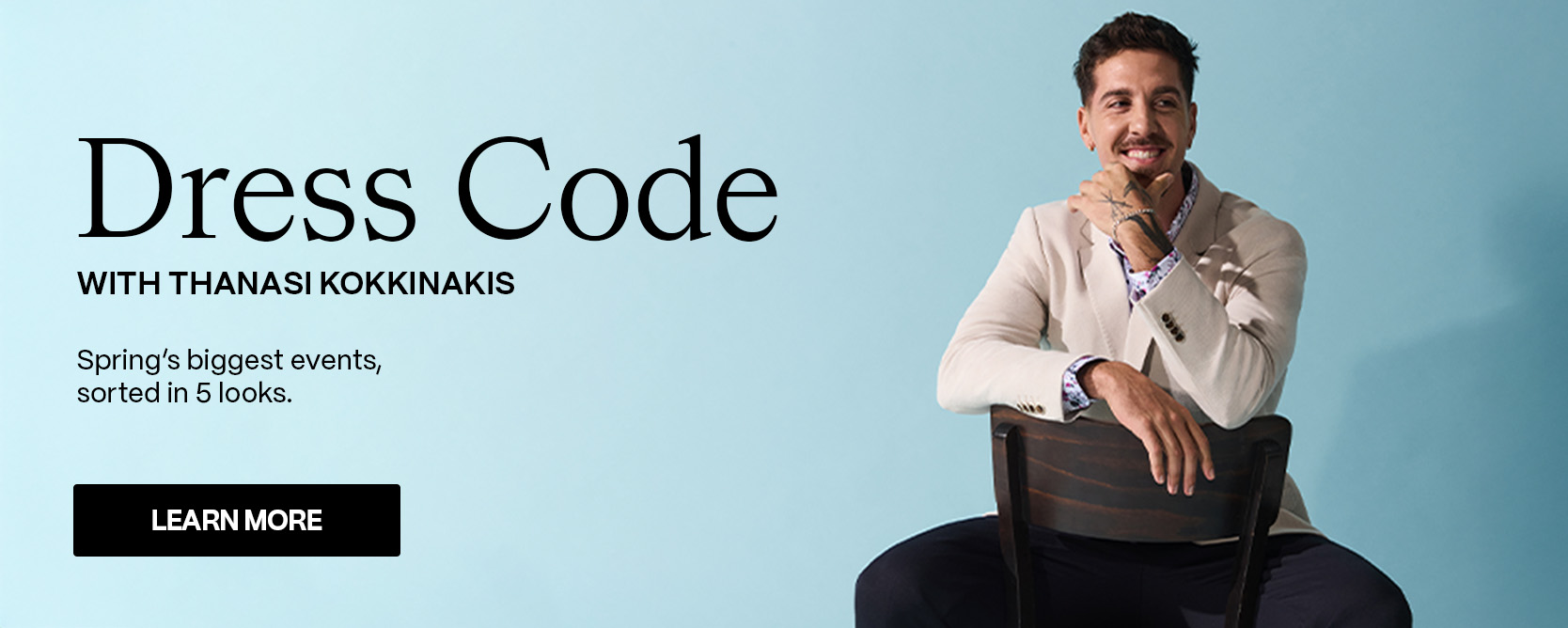 Thanasi Kokkinakis sitting on a chair wearing a light beige POLITIX suit and floral shirt against a pale blue backdrop. Text on image reads ‘Dress Code with Thanasi Kokkinakis – Spring’s biggest events, sorted in 5 looks.’